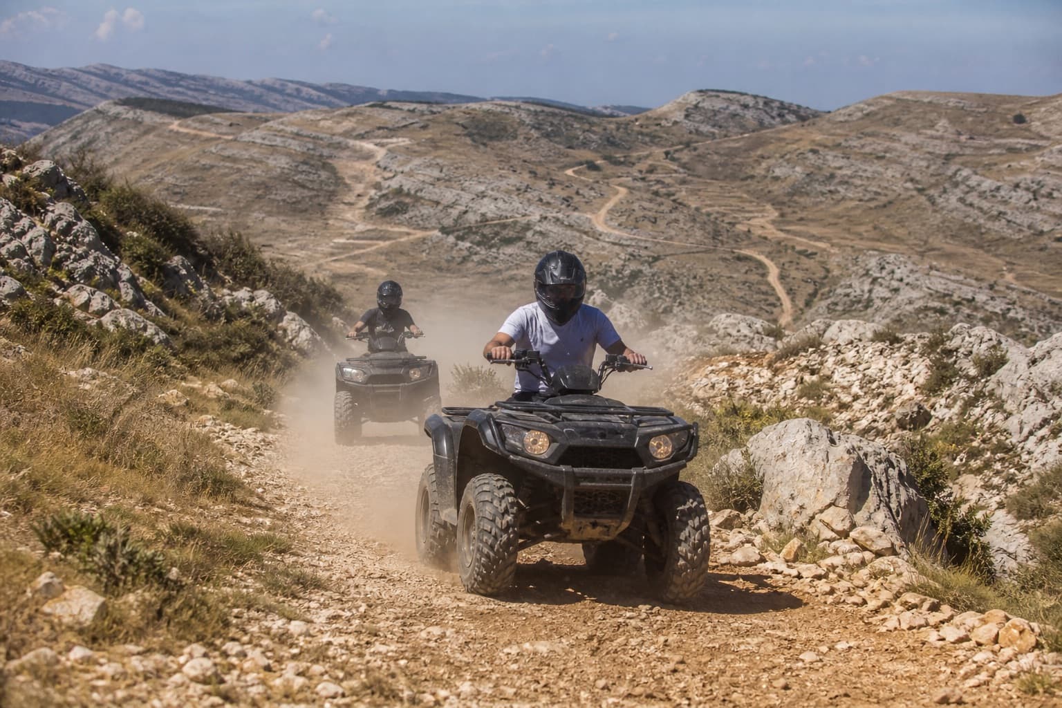 Guided ATV riders on a dirt track above Faraya, Mount Lebanon