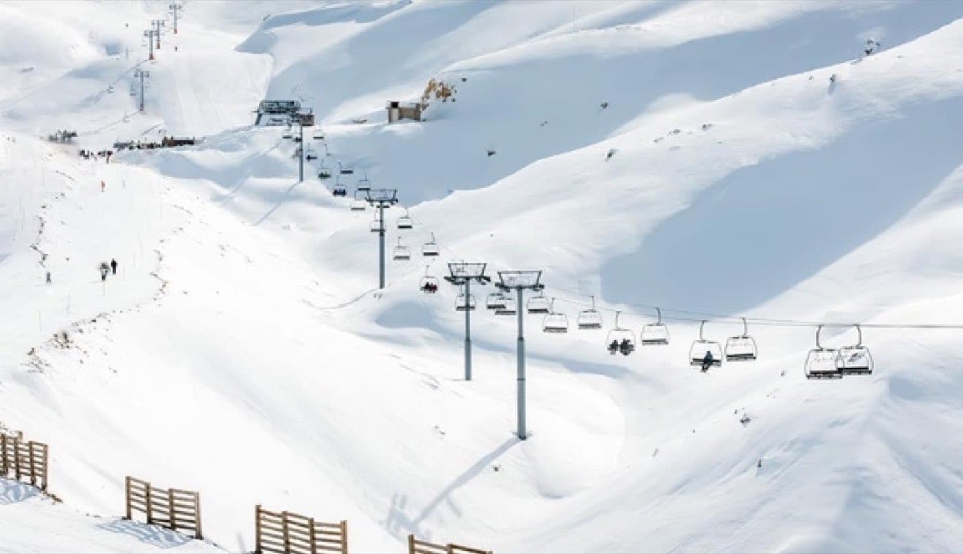 Chairlifts and open snow bowl at Mzaar ski resort, Kfardebian