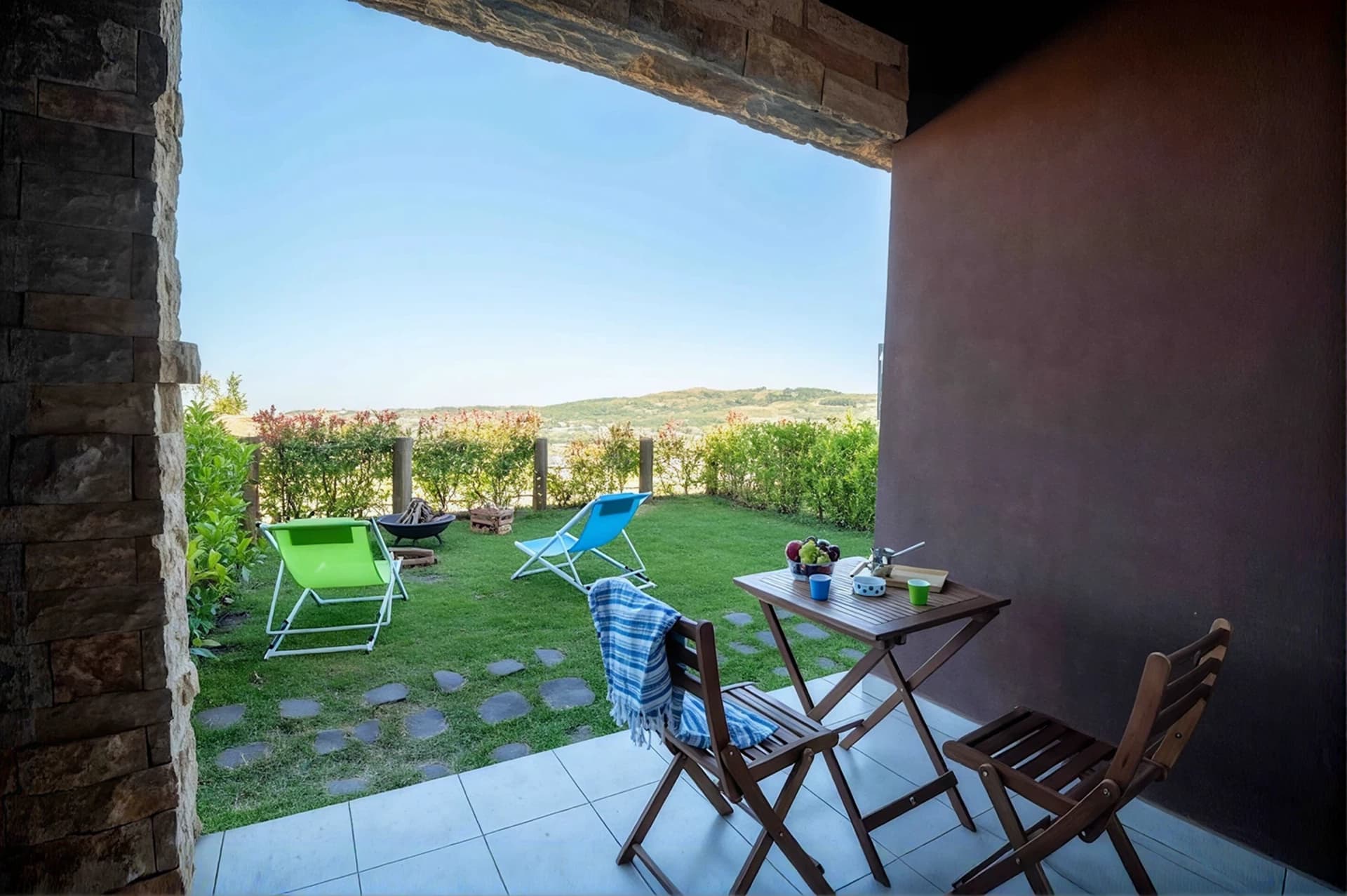 Private patio and lawn at The Nest, looking toward the mountains