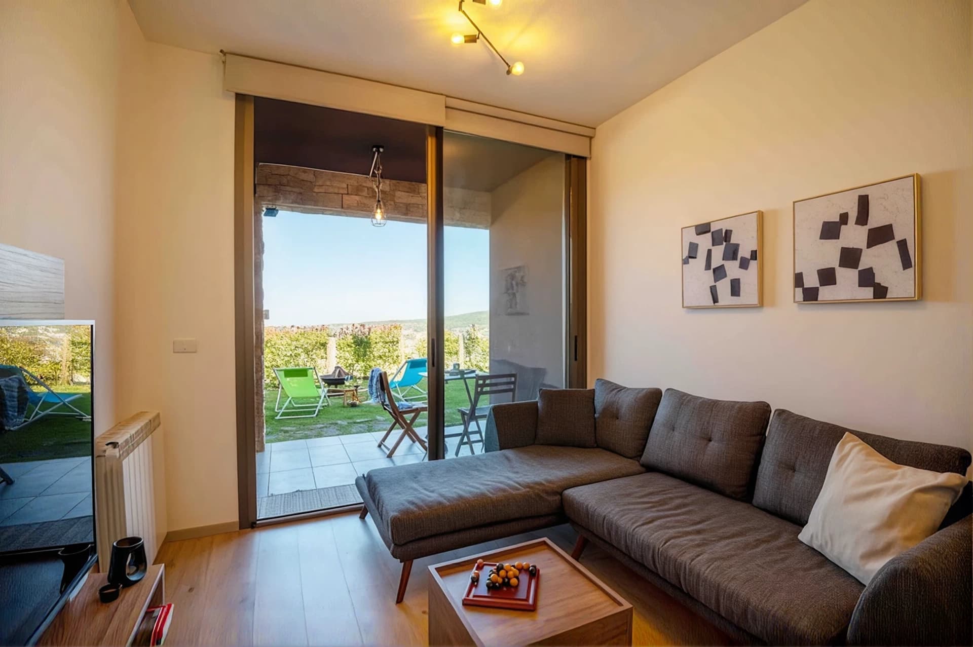 Living room of The Nest opening onto the private patio